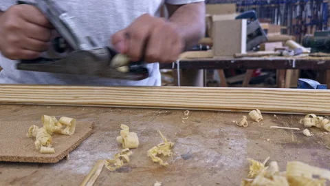 Woodworker planing wood in workshop Stock Footage 337552007