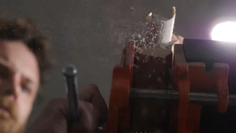 Woodworker polishes poplar tea leaf holder with sanding paper. the art of wood Stock Footage 147871982