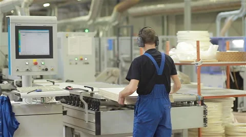 Woodworker preparing the machine. Woodworking factory. Furniture production Stock Footage 48806688
