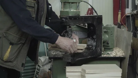 Woodworker puts cutting board on copy shaper machine and sanding edges, close up Stock Footage 88174279