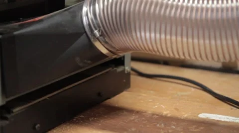 Woodworker putting board through a planer 2 Stock Footage 42234492