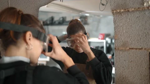 Woodworker putting on glasses in workshop Stock Footage 167421050