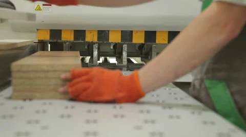 Woodworker putting the plank in to the machine in the middle of a working shop. Stock Footage 54444199