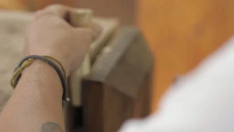 Woodworker rounds a wooden chisel handle with a plane. fhd. 24 fps Stock Footage 137150057