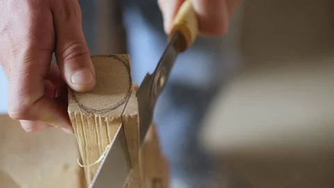 Woodworker saws with a hand saw. handmade carpentry. art of woodworking Stock Footage 156670751