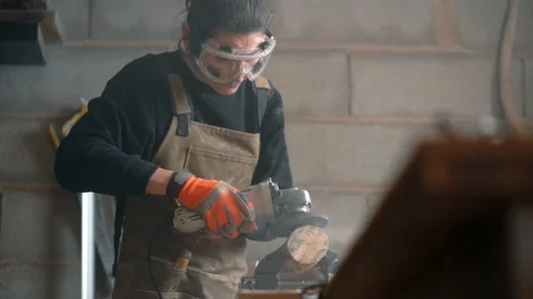 Woodworker using angle grinder in workshop Stock Footage 167422915