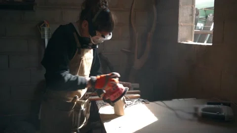 Woodworker using orbital sander for polishing wood Stock Footage 167422545