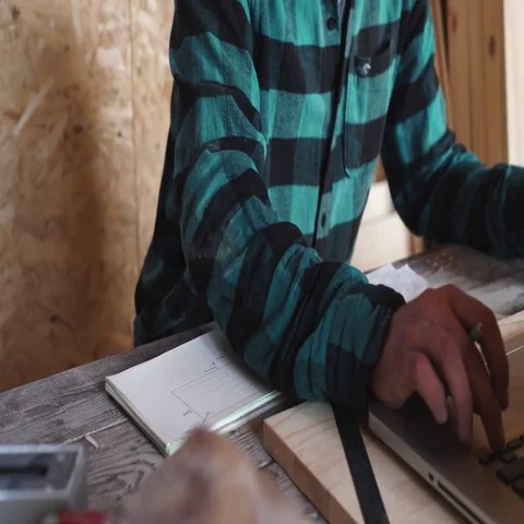 Woodworker work in his workshop with drawing equipment, paper, ruler, pencil and Stock Footage 69532161