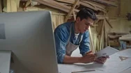 Woodworker Working With Blueprints Stock Footage