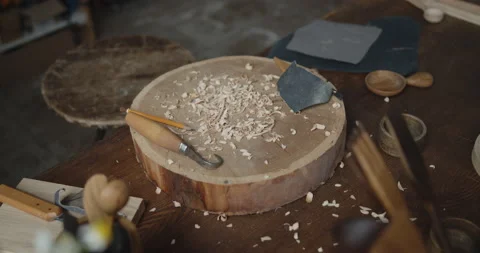 Woodworker's workplace: workbench, carving tools, sandpaper and wood shavings Video stock 135732450