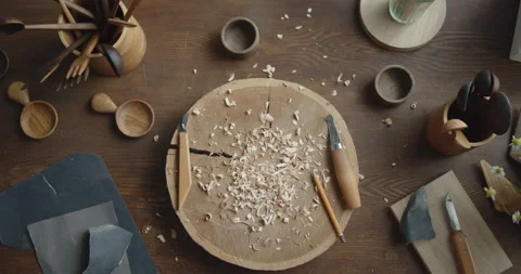 Woodworker's workplace: workbench, carving tools, sandpaper and wood shavings Video stock 135733206