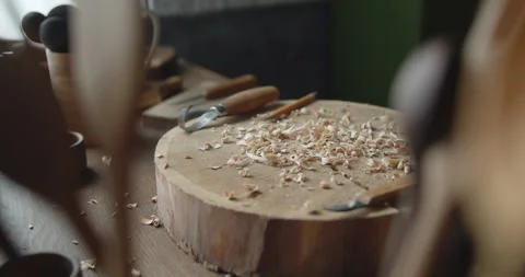 Woodworker's workplace: workbench, carving tools, sandpaper and wood shavings Stock Footage 135733487