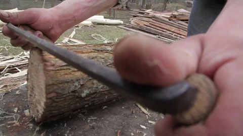 Woodworking. close-up. the man takes the bark out of the logs. scrapers. knife. Stock Footage 72192269