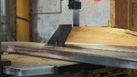 Woodworking factory. Cutting boards into rectangular slats. Slow motion. 4k 動画素材 117700343