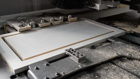 Woodworking industry concept. Processing panels on a woodworking machine. P.. Stock Photos