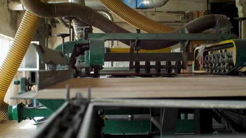 Woodworking machine cuts raw materials in a factory.  Close Up Stock Footage 292932104