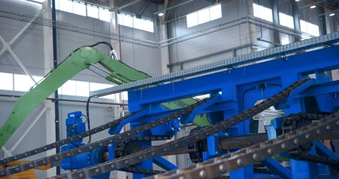 In a woodworking plant, logs are transported by water using a metal chains Stock Footage 161978754