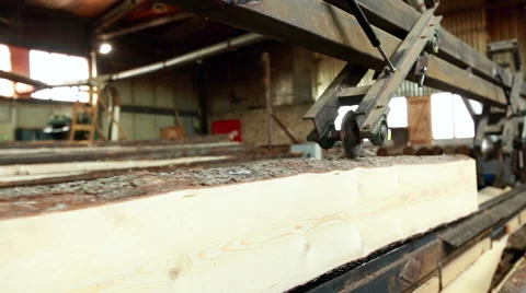 Woodworking. Processing of sawn logs on machine Stock Footage 60828078