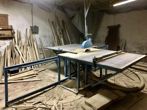 Woodworking setup with tools and materials in a workshop during daylight ho.. Stock Photos