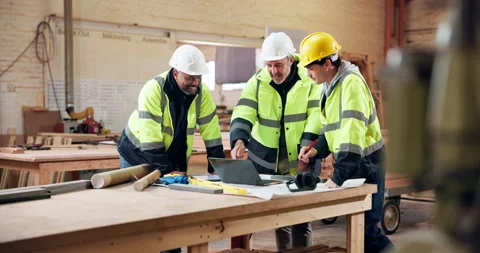 Woodworking, teamwork and men with laptop in workshop, point and furniture Stock Footage 338048837