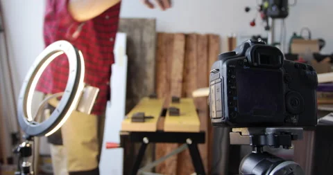 Woodworking vlogging, setting up filming gear, led ring-light and smartphone Stock Footage 154846956