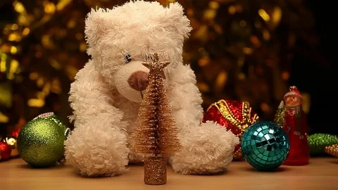Wool bear toy wooden table gold bokeh hd footage Stock Footage 118301760