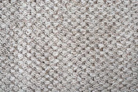 Wool gray crochet blanket as background. Knitted macro texture, close-up of b Stock Photos