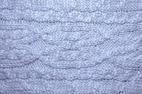 Wool hand-knitted or machine knitting pattern. Stock Photos
