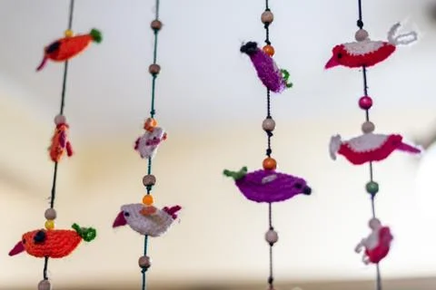 Wool handcrafted birds on strings Stock Photos