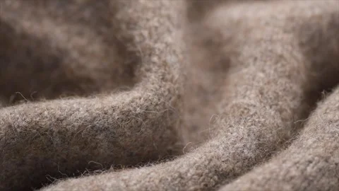 Wool knitted background. Real natural beige color wool mohair clothes texture Stock Footage 343322406