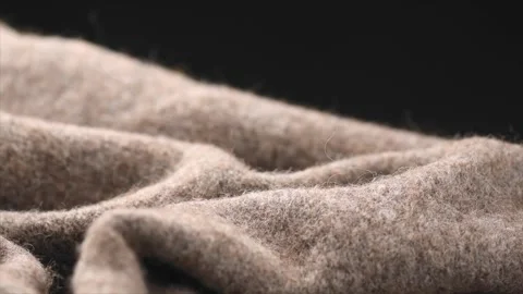 Wool knitted on black background. Real natural beige color wool mohair clothes Stock-Footage 341894820