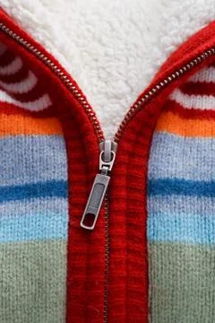 Wool knitted sweater and closeup zipper Stock Photos