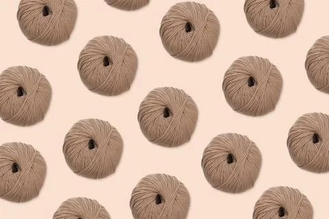 Wool knitting pattern on beige background Stock Photos