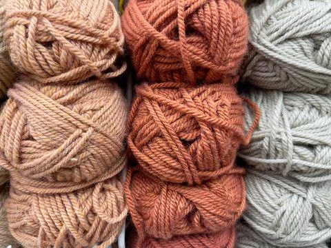 Wool knitting threads as a background. Close-up. Brown and gray colors Stock Photos