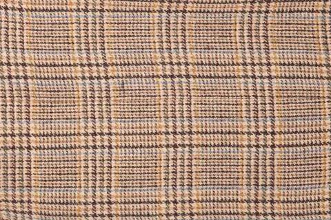Wool plaid texture. Soft and warm folded alpaca wool blanket. Green and ora.. Stock Photos