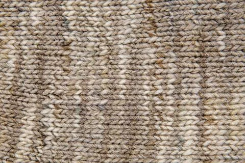Wool scarf texture close up. Knitted jersey background with a relief pattern. Stock Photos