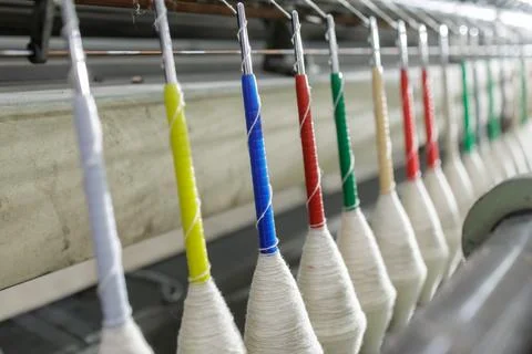 Wool Spinning Machine in Textile Factory with Colorful Spools Stock Photos