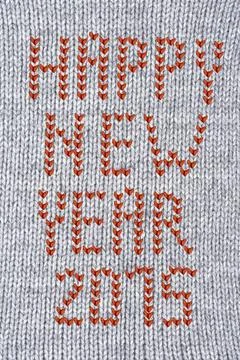 Wool texture Woven wool white fabric texture with happy new year 2015 sign... Stock Photos