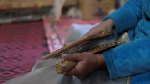 Wool thread making process. Woven mats and loom white thread homemade. Creating Stock Footage 104147435