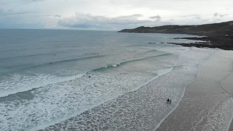 Woolacombe North Devon Winter Surf Aerial Of Rocky Coastline And Surfing Beach Stock Footage 123304375