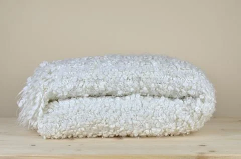Woolen Blanket Folded on Shelf Stock Photos