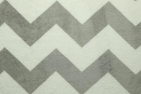 Woolen fabric with geometrical pattern as background, top view Stock Photos