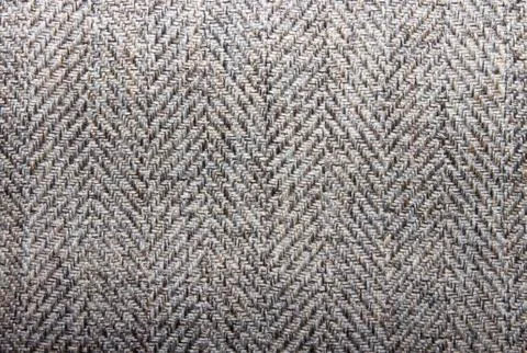 Woolen fabric texture.Background wool texture in a herringbone pattern. Stock Photos