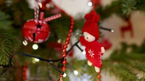 Woolen handmade doll with red knit hat swinging on Christmas tree Stock Footage 145297824