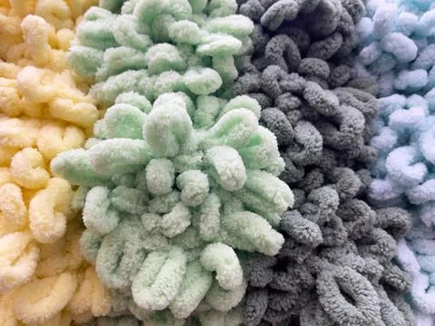 Woolen knitted texture as a background. Close-up. Stock Photos