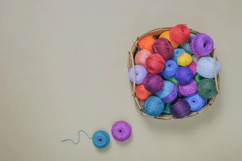 Woolen or cotton balls of thread in a basket, balls of bright colors Stock Photos