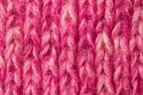 Woolen texture background, knitted wool fabric, pink hairy fluffy textile Stock Photos