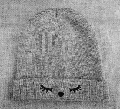 A woolen warm gray winter hat Stock Photos