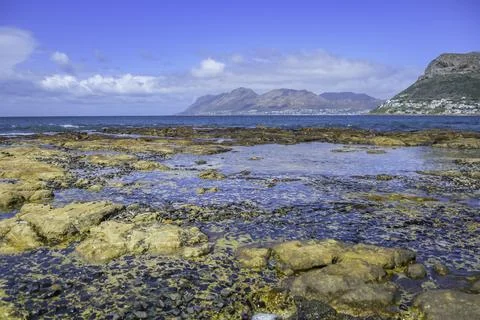 Woolley's tidal pool with turquoise green water in Kalk bay near Fishhoek C.. Stock Photos