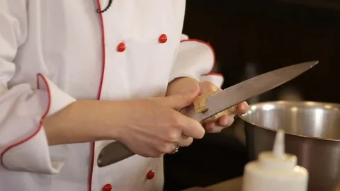 Wooman clean ginger with knife Stock Footage 74716096